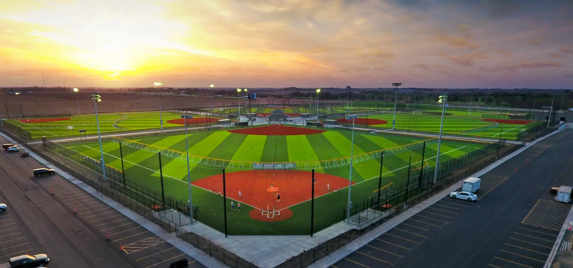 Aerial view of TBK Sports Complex baseball fields at sunset